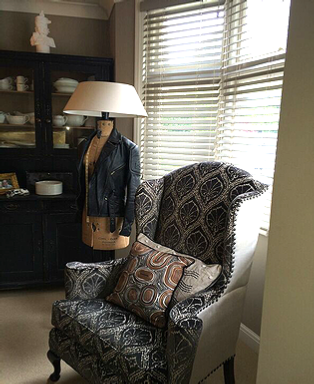Paisley-upholstered-wingback-armchair-with-matching-cushions